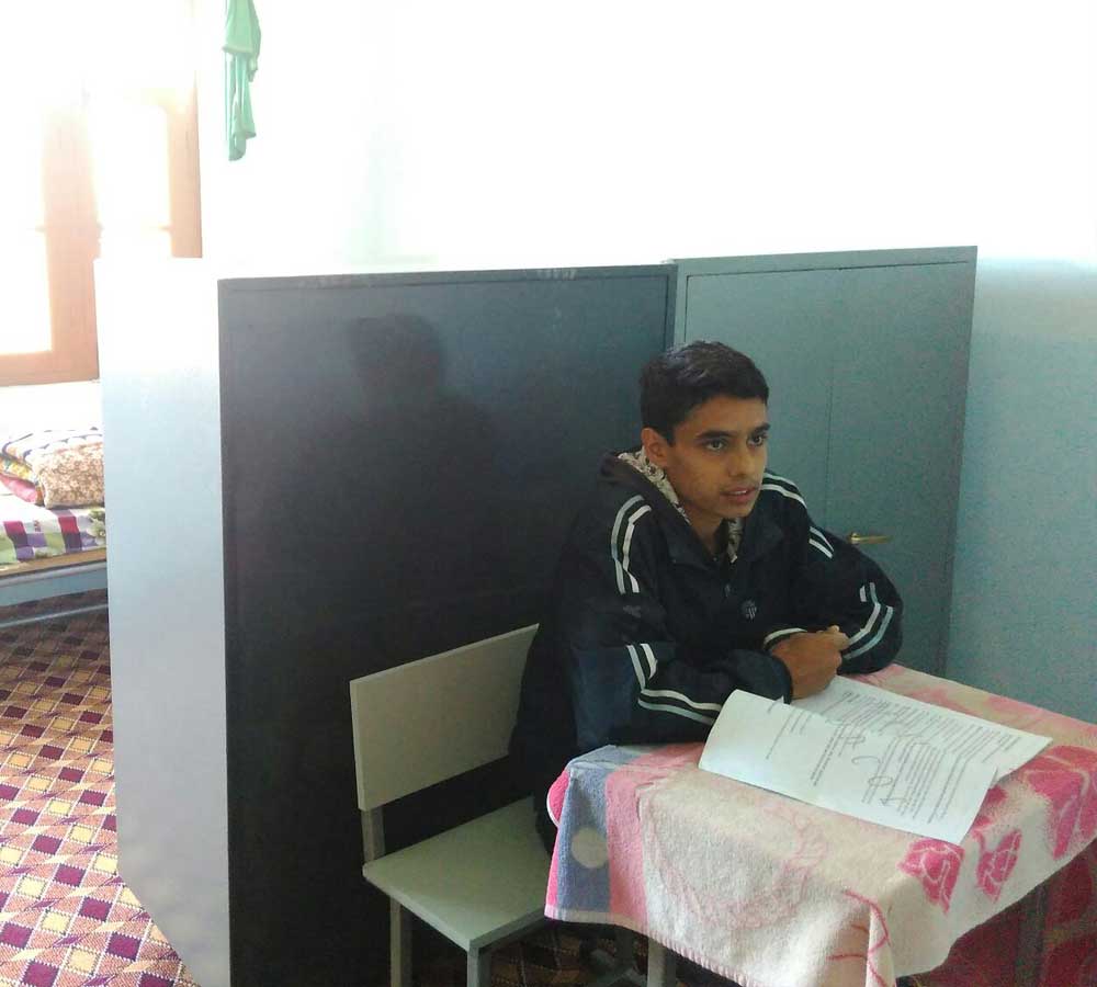 Child Studying at CHINAR Home