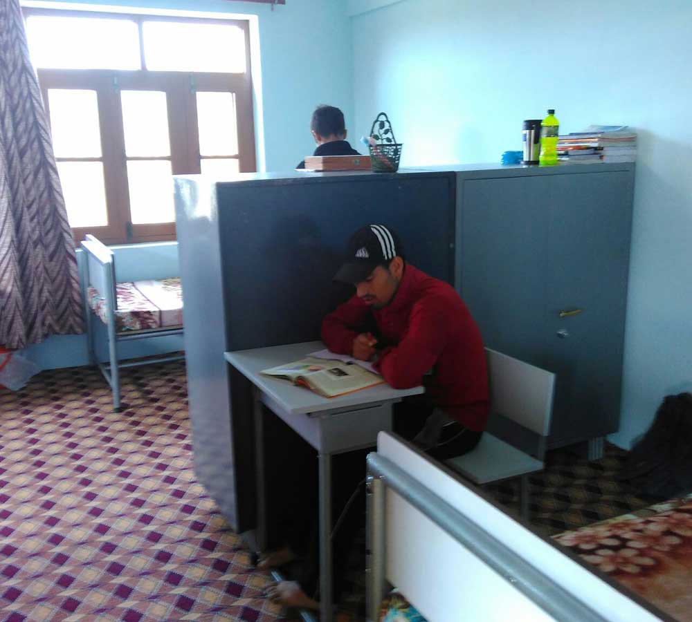 Child Studying at CHINAR Home