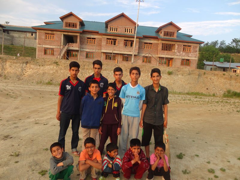 Group photo of Children during Cricket Match