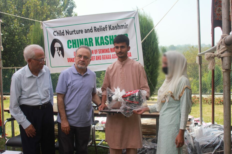 CHINAR Kashmir's president, Mr. Nazir Ahmed Qureshi along with Mr. Rass Masood Shayik, head of Relief and Rehabilitation Asia Incorporation providing free sewing machines at CHINAR Kashmir Home in Khanpora Budgam